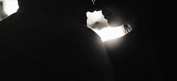 Silhouette couple kissing on sunset
