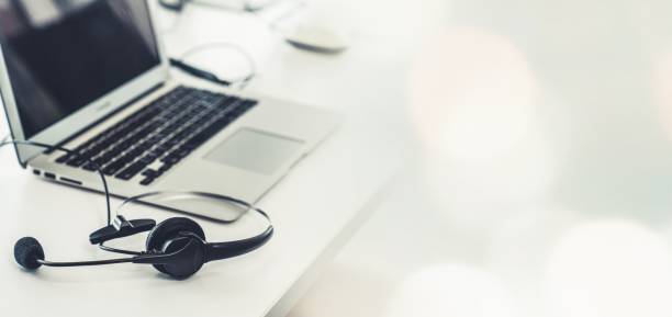 istock Headset and customer support equipment at call center ready for actively service . Corporate business help desk and telephone assistance concept . 1465513430