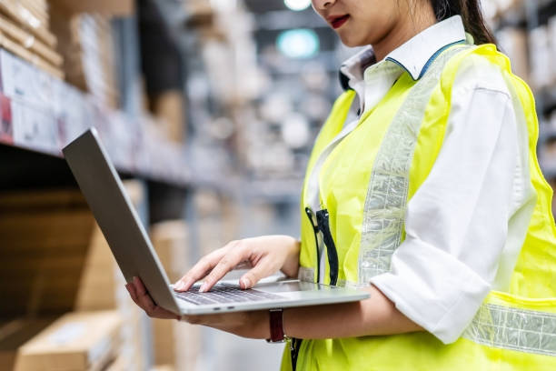 istock Engineer woman check stock details on tablet computer for checking boxes with logistics on shelves 1465514850