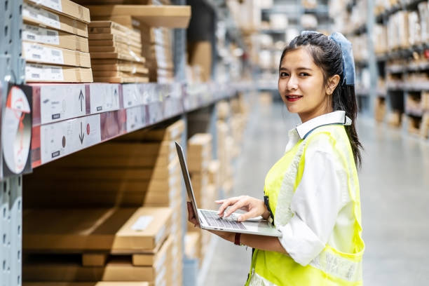 istock Smiling engineer woman check stock details on tablet for checking boxes with logistics on shelves 1465514868