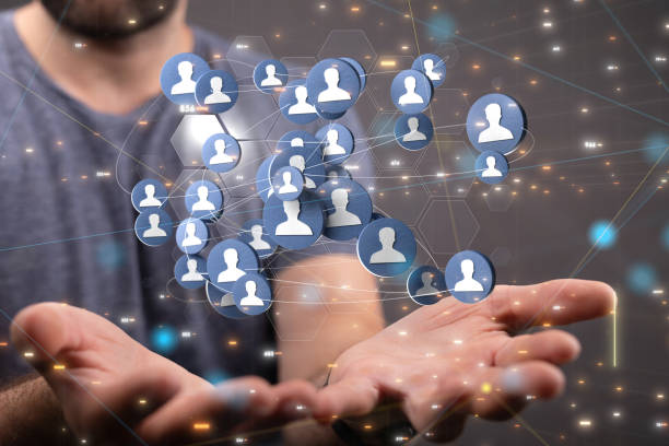 istock Male's hands holding illustrated business and communications group 1465516574