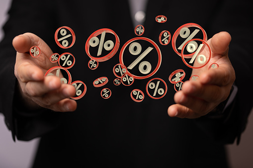 A 3D render of a Percent sign concept of sale discount in hands