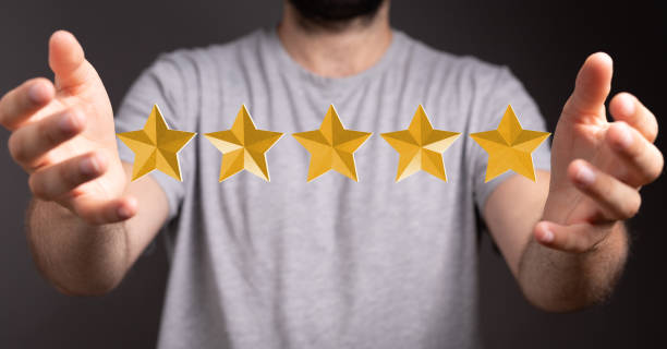 istock 3D rendering of a five-stars rating hovering between man's hands 1465517969
