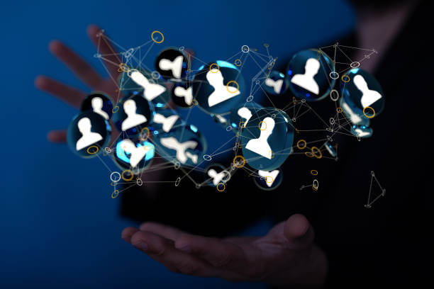istock 3D rendering of human icons floating over a man's palm 1465518023