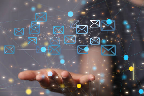 istock Abstract shot of a man's hand showing rendered digital email and messages linked on the web 1465518158