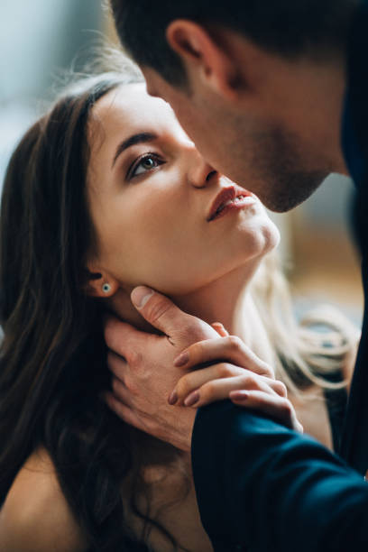 istock girl and guy cuddle each other 1465518231