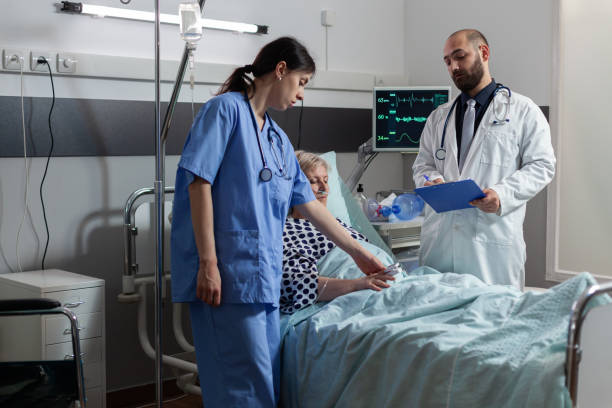 istock Sick senior woman getting medication through an intravenous line 1465521158