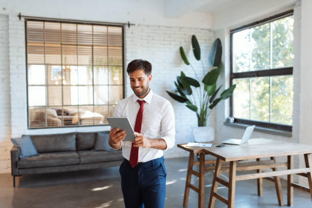 istock Handsome man using digital tablet and app for electronic banking, finances, smart home devices 1465522660