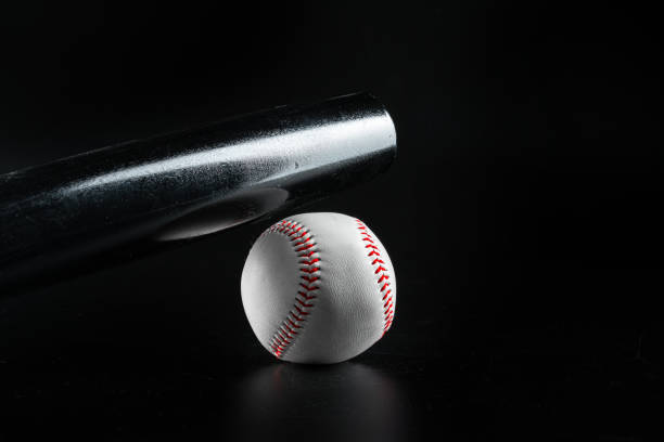 istock Baseball game equipment on dark black background 1465524301