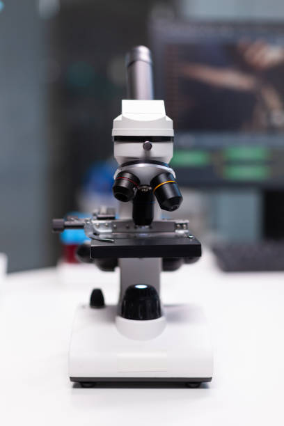 istock Close up of professional microscope in laboratory space 1465525022
