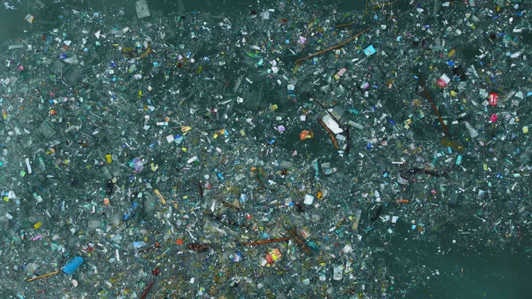 Ocean and plastic trash, aerial view. Pollution by plastic rubbish