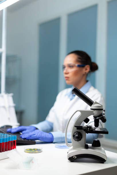 istock Selectiv focus on medical microscope standing on table in biochemistry hospital 1465525460
