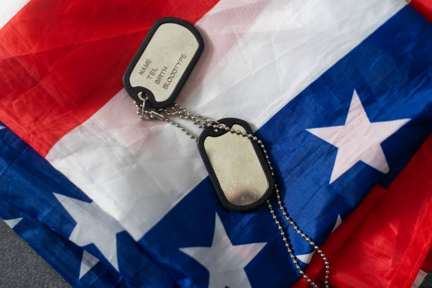 istock Soldier's token on American flag background. 1465528175