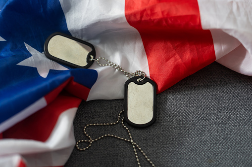 Soldier's token on American flag background