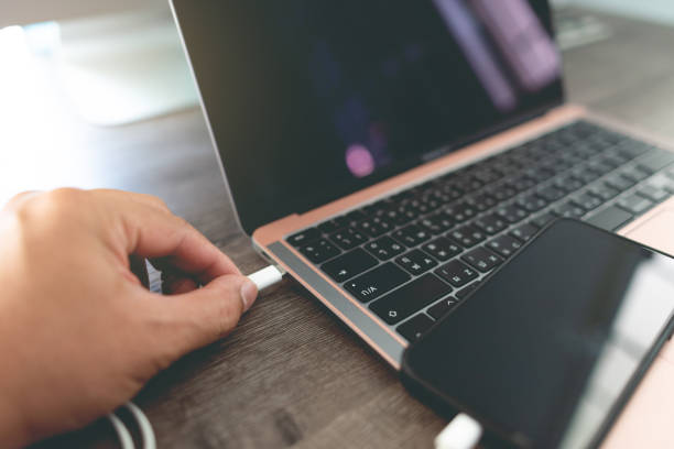 istock connect smartphone to the laptop with a USB cable. 1465531063