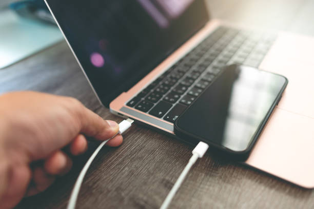 istock connect smartphone to the laptop with a USB cable. 1465531616