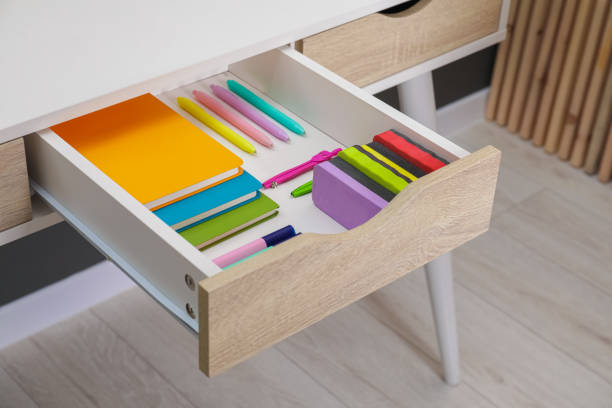 istock Office supplies in open desk drawer indoors 1465532877
