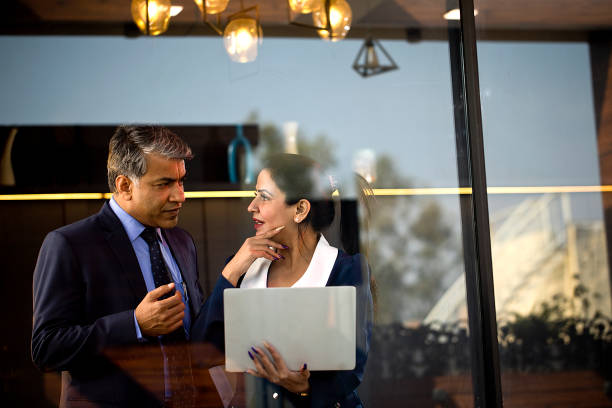 istock Business people discussing using laptop at office 1465533996
