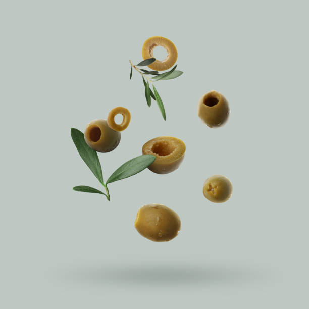 istock Fresh olives and leaves falling on light grey background 1465534532