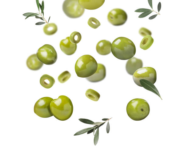istock Fresh olives and leaves falling on white background 1465534535