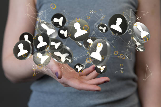 istock Abstract shot of a woman's hand presenting 3D rendered contact icons networking on the web 1465536202