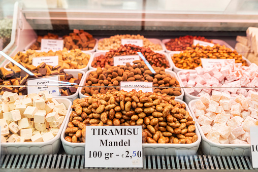 Display of a candy shop with with candied almonds in Naschmarkt, street food market in Vienna, Austria