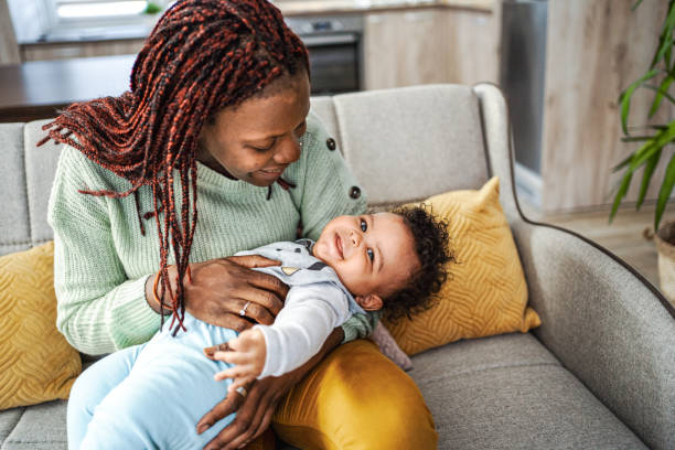 istock Caring black mother playing with her little baby boy 1465539115