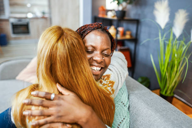 istock Two multiracial female friends hugging 1465539513