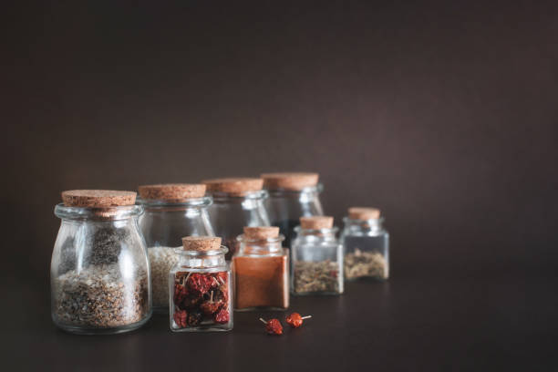 istock Various herbs and spices in round and square glass jars. Environmentally friendly cork lids. 1465540984