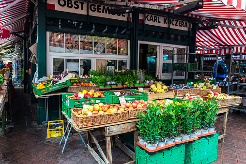 Vienna, Austria - October 14, 2022: Fruit and vegetable shop in Naschmarkt, street food market in Vienna, Austria