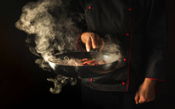 istock Molecular gastronomy or cuisine. Chef cooking vegetables in a frying pan. Menu for restaurant or hotel with advertising space 1465542103