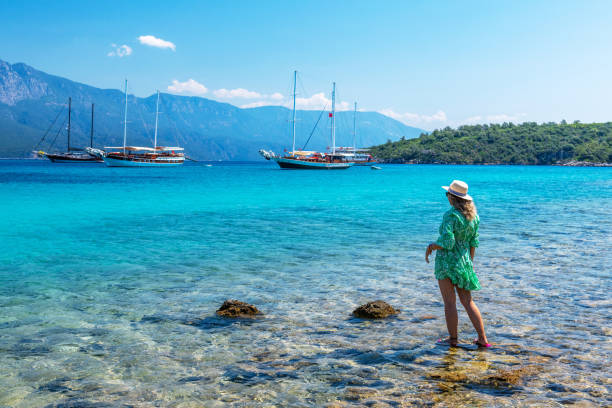 Female tourist on Sedir island in Marmaris district of Mugla province in Turkey. Türkiye de Mugla ili Marmaris ilçesindeki Sedir adası. marmaris stock pictures, royalty-free photos & images