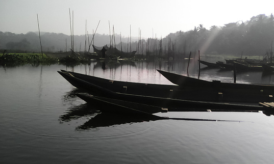 Old photo of wooden boats dock in Rawa Pening (Rawapening) lake in the morning
