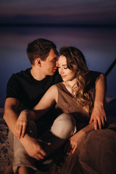 istock young couple having a picnic on the beach 1465543769