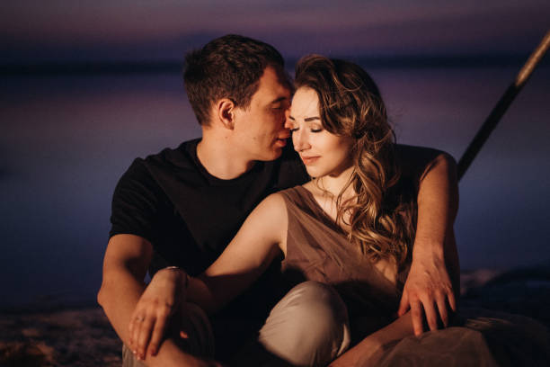 istock young couple having a picnic on the beach 1465543856