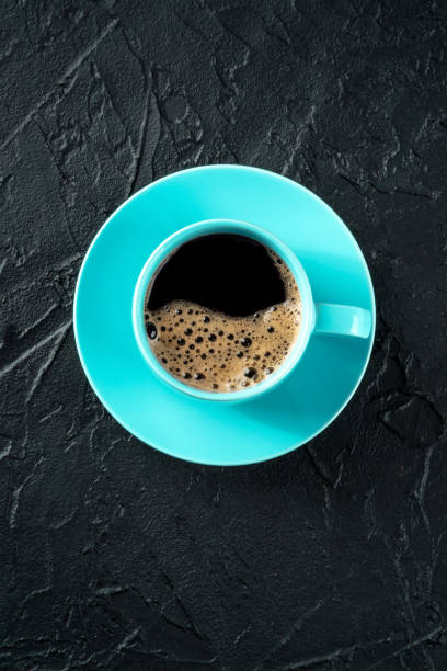 istock Coffee cup, shot from the top on a black slate background with copy space 1465544312