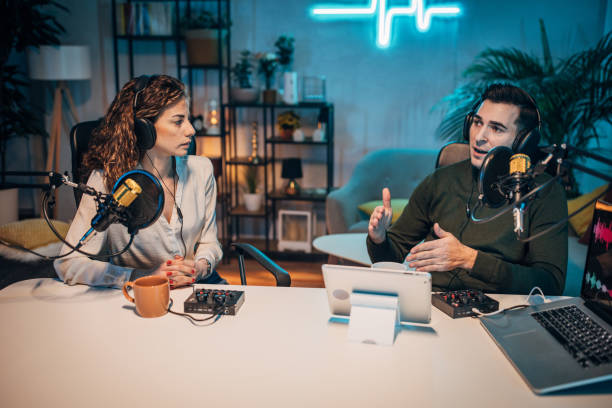 istock People in the podcast studio talking and recording 1465553616