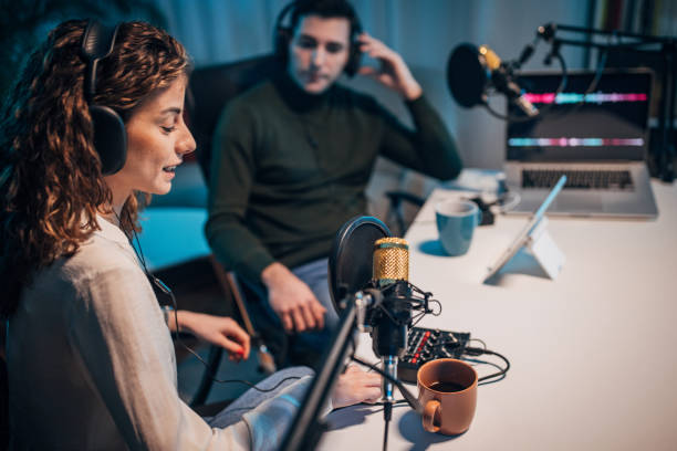 istock People in the podcast studio talking and recording 1465555401