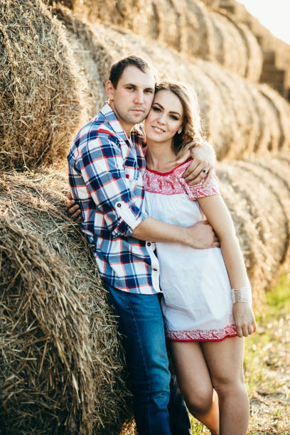 istock a guy with a girl on a summer walk in the field 1465555522
