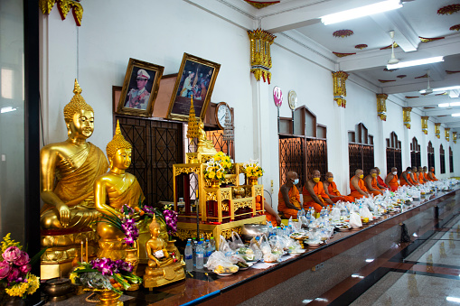 The sitting buddha statues inside of Wat Pho (Temple of the Reclining Buddha) in Bangkok in Thailand.