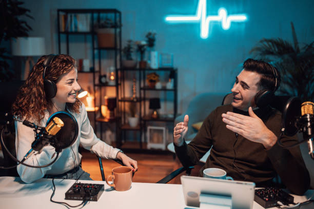 People in the podcast studio talking and recording stock photo