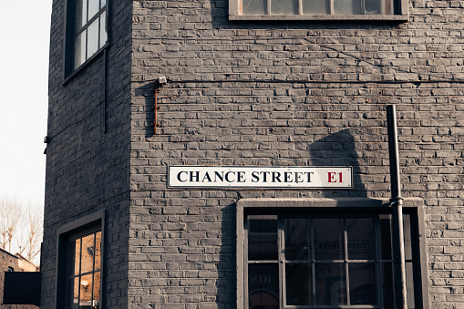 istock Street name sign on a wall of a building on Chance Street in East London, UK. 1465556326