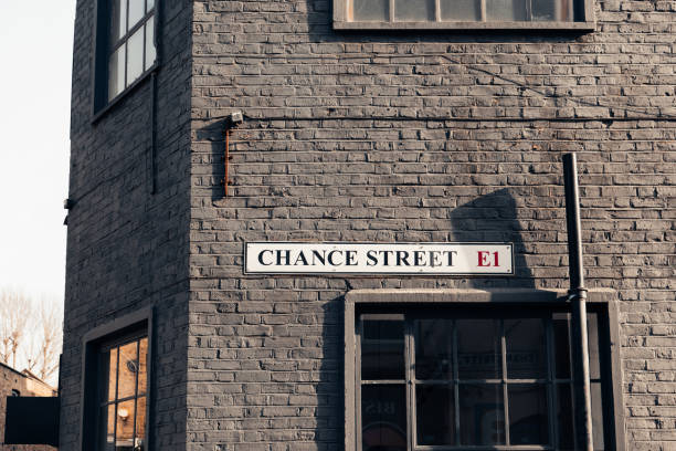 Street name sign on a wall of a building on Chance Street in East London, UK. Street name sign on a wall of a black brick building on Chance Street in East London, UK. street name sign stock pictures, royalty-free photos & images