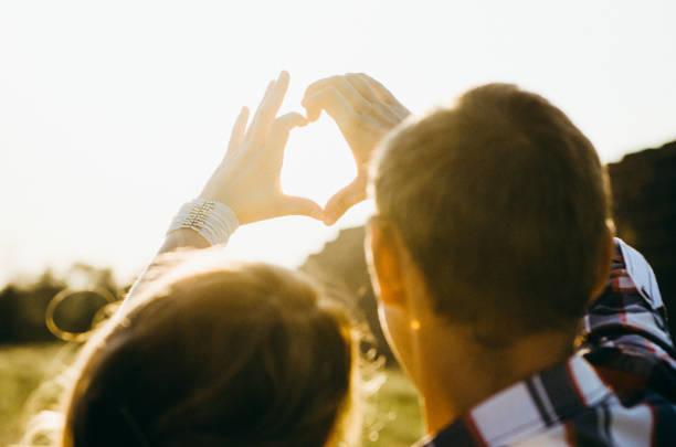 istock a guy with a girl on a summer walk in the field 1465558328