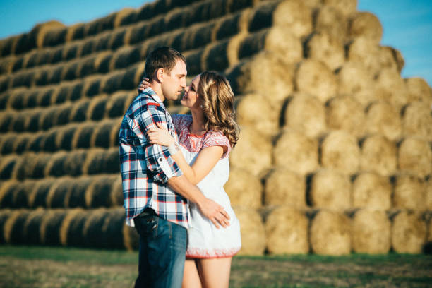 istock a guy with a girl on a summer walk in the field 1465559059