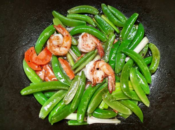 istock Stir fried Green Pea with Shrimps - food preparation. 1465560844
