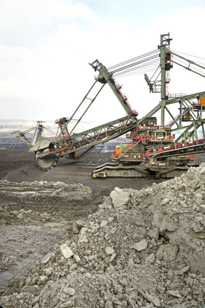 istock Bucket-wheel excavator during excavation at the surface mine. Huge excavator on open pit mine. 1465561150