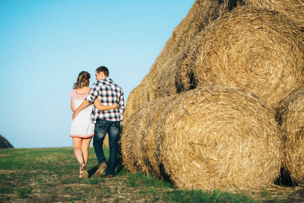 istock a guy with a girl on a summer walk in the field 1465561363