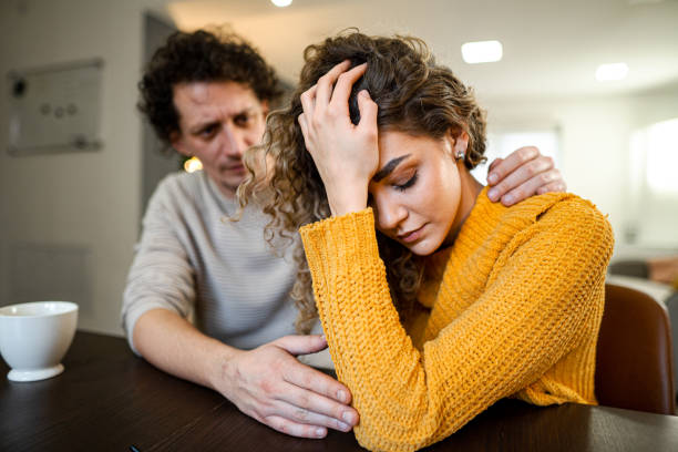 istock Loving husband comforting his wife 1465561415