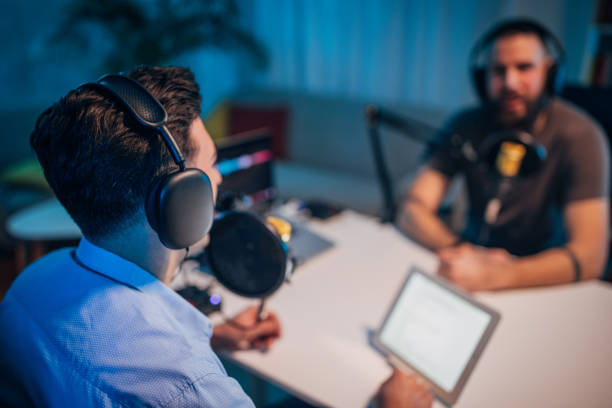 istock People in the podcast studio talking and recording 1465562581